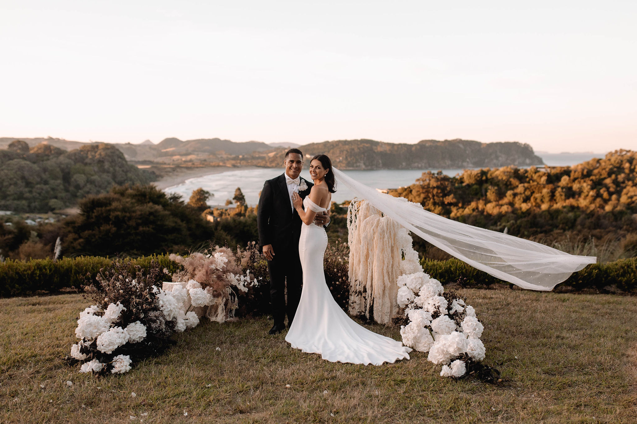 Wedding ceremony overlooking mountains and lake in New Zealand.