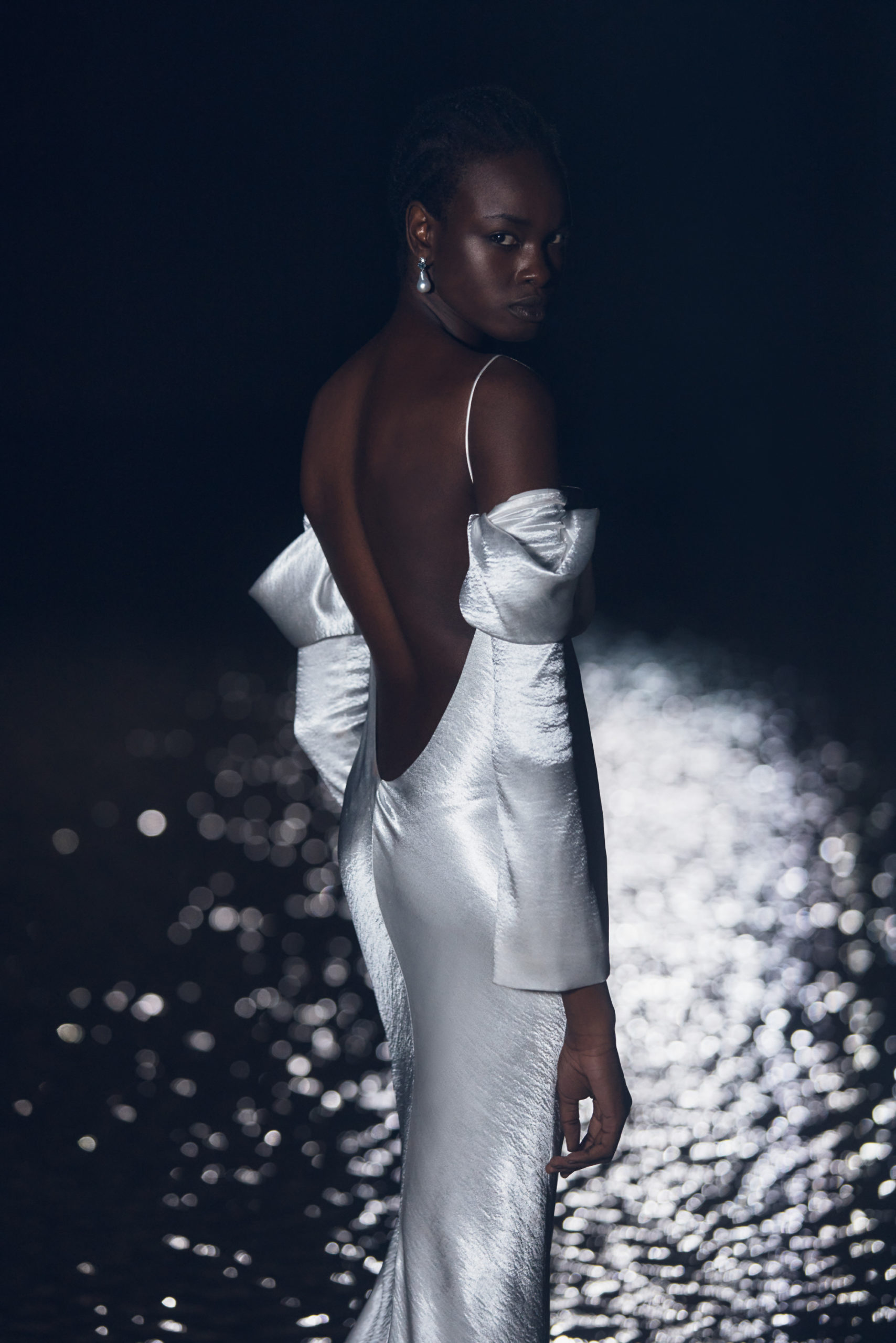 Backless image of a Newhite wedding dress modelled on The Lane's Fall 22 Bridal Week Runway.
