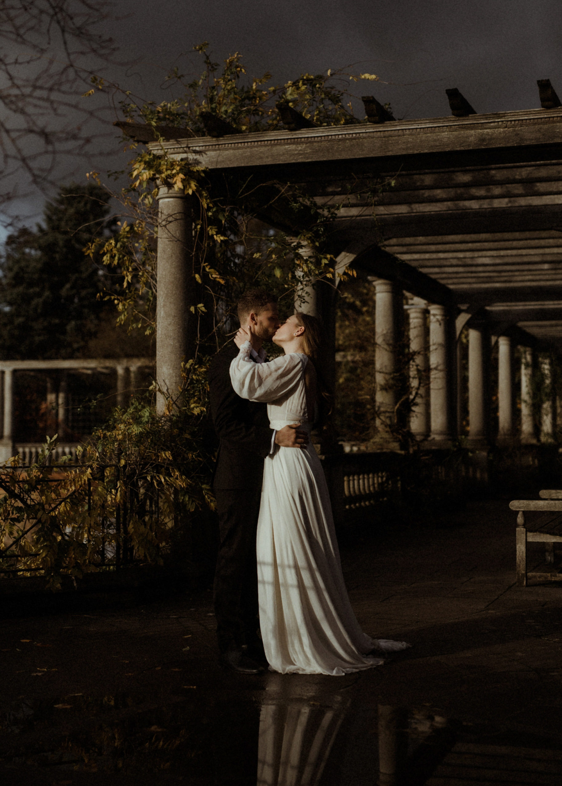 Bride and groom embracing in European chateau