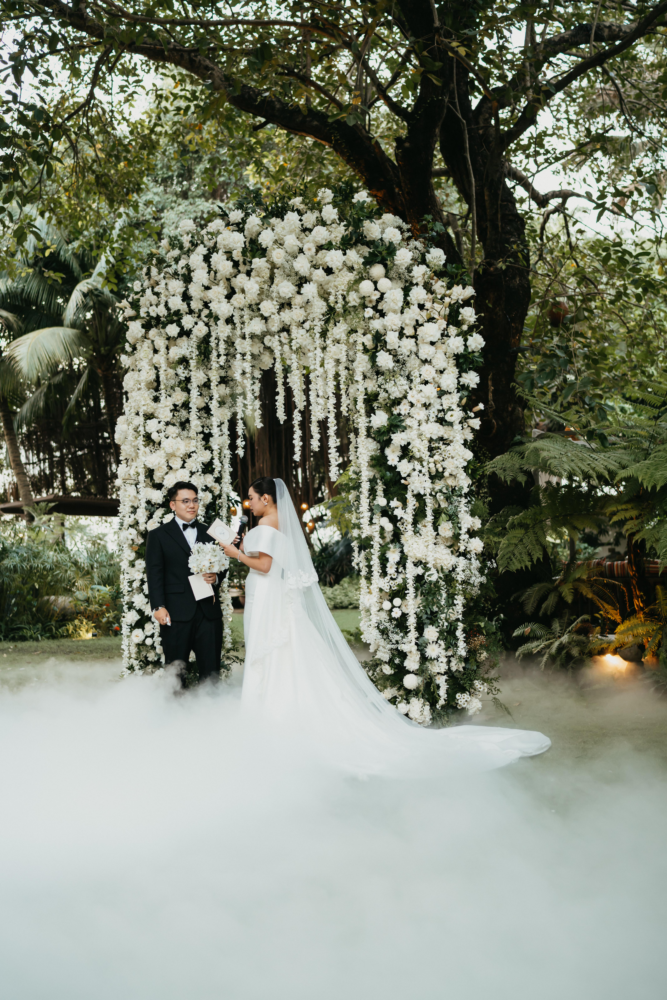 Cascading White Roses at a Saigon Riverside Wedding in Vietnam